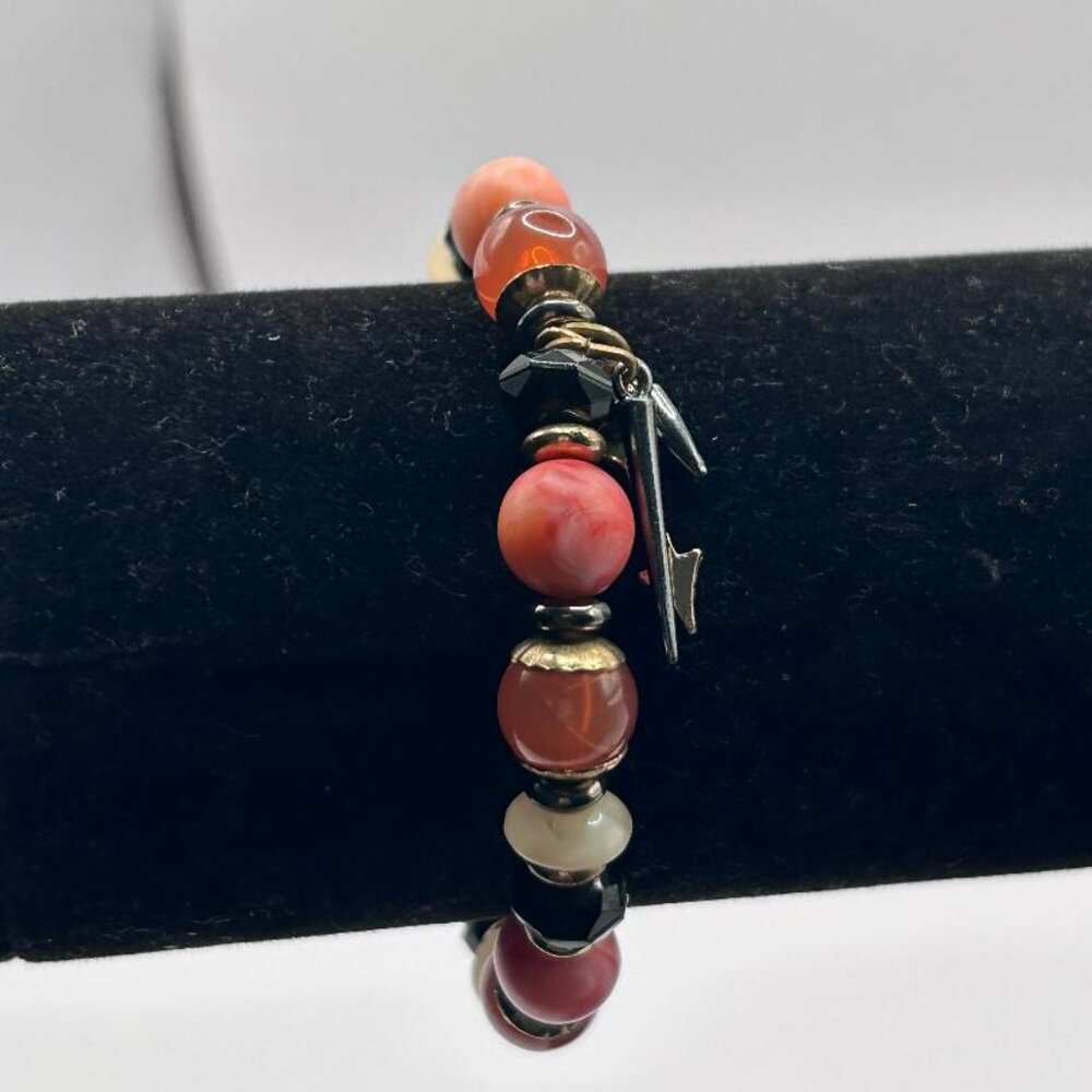 Peach and gold accent elastic bracelet with arrow charms